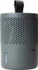 A gray cylindrical dehumidifier with a black handle on top, set against a white background. Produktbild-Vorschau