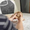 A person's hands are assembling a wooden globe puzzle. Náhľad obrázku produktu