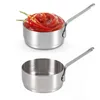 Two stainless steel saucepans, one filled with ketchup and chili peppers, the other empty. Produktbild-Vorschau