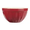 A red ceramic bowl with a cream interior, shown against a white background. Produktbild-Vorschau