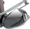 A close-up view of a smartphone being placed into a zippered pocket on a backpack. Anteprima dell’immagine prodotto