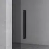 A close-up view of a black handle on a glass door, set against a textured gray wall. Produktbild-Vorschau