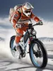 A person riding an electric mountain bike in a snowy, mountainous environment. Produktbild-Vorschau