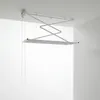 A ceiling-mounted clothes drying rack is shown in a white room. Podgląd zdjęcia produktu