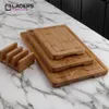 A set of bamboo cutting boards with a holder, displayed on a marble countertop. Produktbild-Vorschau