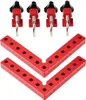A set of woodworking clamps and L-shaped squares on a white background. Náhled obrázku produktu