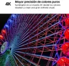 A brightly lit Ferris wheel at night, with text overlay describing "4K" and "Mayor precisión de colores puros". Voir les images du produit