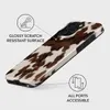 A phone case with a cow print pattern is shown with callouts highlighting its features. Náhled obrázku produktu