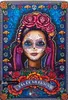 The image shows the packaging for a Barbie doll celebrating Día De Muertos. The packaging features a detailed illustration of a woman with traditional Día De Muertos face paint, adorned with roses and marigolds. The background is a vibrant blue with decora Produktbild-Vorschau