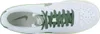 A top-down view of a white Nike sneaker with green laces and accents. Produktbild-Vorschau
