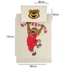 A flat lay image of a duvet cover and pillowcase set featuring a cartoon bear mascot. Dimensions are indicated with measurement lines and text. Produktbild-Vorschau