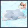 A woman sleeping on a pillow, with a larger pillow in the foreground. Produktbild-Vorschau