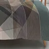 A close-up view of a geometric patterned bedsheet. Produktbild-Vorschau