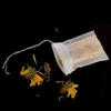 A tea bag filled with dried herbs and flowers, with some loose herbs scattered around it, on a black background. Anteprima dell’immagine prodotto