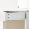 A close-up view of an open white drawer with visible screws and a metal drawer slide. Voir les images du produit