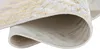 A close-up view of a rolled-up rug, showing the texture and pattern of the fabric. Produktbild-Vorschau