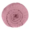 A rolled-up pink fitted sheet is shown from a top-down perspective against a white background. Produktbild-Vorschau