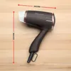 A brown ProfiCare hair dryer is shown on a wooden surface with dimensions indicated by red lines and text. Anteprima dell’immagine prodotto