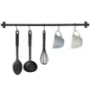 Kitchen utensils hanging on a rack. Náhled obrázku produktu