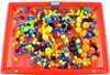 A red plastic basket filled with colorful mosaic puzzle pieces. Anteprima dell’immagine prodotto