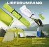 A pop-up pavilion and its accessories are displayed in a grassy outdoor setting with a lake and mountains in the background. Voir les images du produit