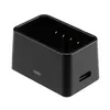 A black USB charging dock for camera batteries. Podgląd zdjęcia produktu