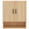 A front view of a light brown wooden cabinet with two black handles and an open shelf below. Voir les images du produit