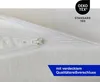 A close-up of a white zipper on a white fabric. Produktbild-Vorschau