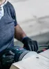 A person is using a sander on a wooden surface. Produktbild-Vorschau