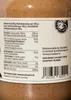 A close-up of a jar of nut butter with a nutrition label. Produktbild-Vorschau