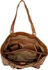 An open brown leather tote bag showing its interior compartments. Voir les images du produit