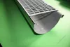 A close-up shot of a gutter guard system on a green surface. Produktbild-Vorschau