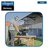 A man is using a wood splitter in a backyard setting. Produktbild-Vorschau