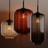 Three pendant lights of different colors arranged together. Produktbild-Vorschau