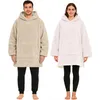 A man and a woman are posing in oversized hoodies. Produktbild-Vorschau