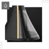 Close-up shot of a sleek black and gold appliance with a transparent water reservoir. Podgląd zdjęcia produktu