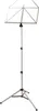 A silver music stand with a tripod base. Produktbild-Vorschau