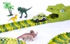 A toy dinosaur race track with toy dinosaurs and a toy car. Produktbild-Vorschau