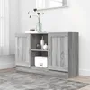 A gray wooden sideboard with two doors and shelves, decorated with vases and a box. The sideboard is placed on a gray rug in a room with a white wall and a window with white curtains. Voir les images du produit