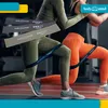 Two women exercising with resistance bands around their legs. Voir les images du produit