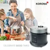 A family is cooking in a kitchen with a rice cooker on the side. Anteprima dell’immagine prodotto
