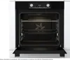 An open oven with a rack and baking trays inside, showing the interior of the appliance. Produktbild-Vorschau