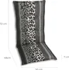 A high chair cushion with a leopard print and striped pattern, shown from the side with dimensions indicated. Produktbild-Vorschau