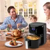 A family is enjoying a meal together, with an air fryer prominently displayed on the table. Produktbild-Vorschau