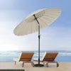 Two lounge chairs and a large umbrella on a wooden deck overlooking the ocean. Anteprima dell’immagine prodotto