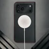 A black iPhone case with red stitching is shown with a white MagSafe charger attached. Anteprima dell’immagine prodotto