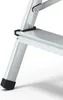 A close-up view of the lower section of an aluminum stepladder. Produktbild-Vorschau