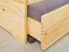 Close-up view of the side of a wooden bed frame with a gray mattress and a wheel visible underneath. Produktbild-Vorschau