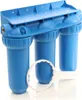 A blue three-stage water filter system with a white filter wrench in the foreground, set against a white background. Produktbild-Vorschau