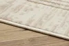A close-up view of the edge of a rug on a wooden floor. Produktbild-Vorschau